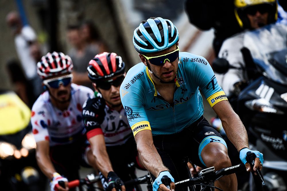 Tanel Kangert (R), Croatia's Kristijan Durasek (C) and France's Julian Alaphilippe, wearing the best climber's polka dot jersey, ride during a breakaway in the first pass of the 17th stage