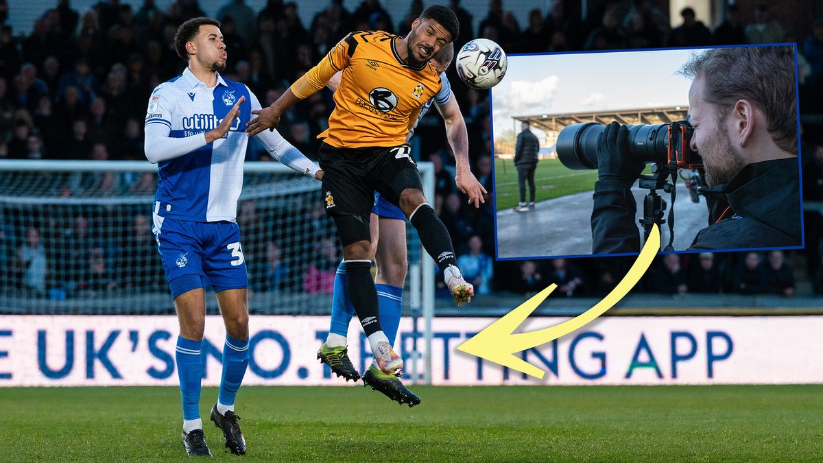 Two soccer players challenging to header the ball, inset image of man photographing the sport from the sidelines 