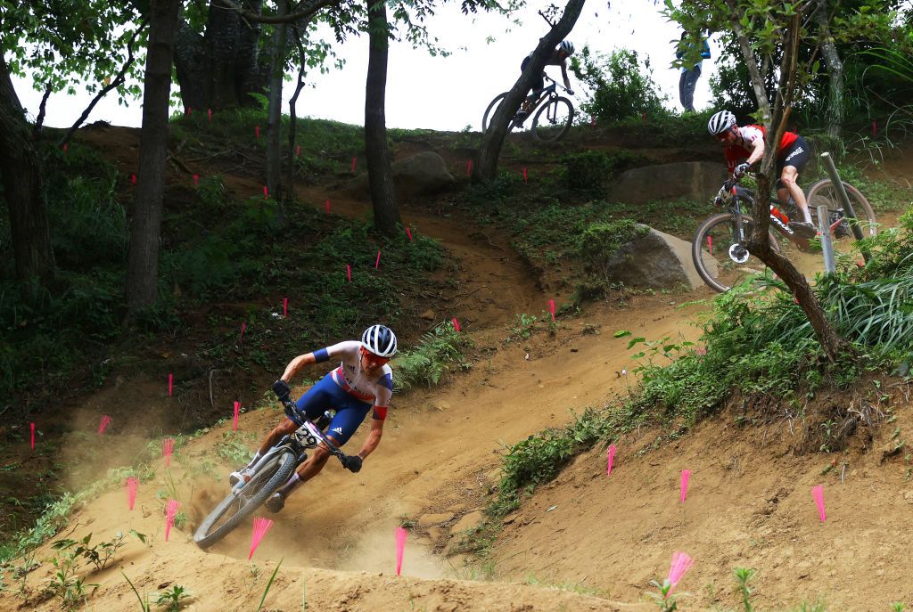 IZU JAPAN JULY 26 LR Thomas Pidcock of Team Great Britain ahead of Mathias Flueckiger of Team Switzerland during the Mens Crosscountry race on day three of the Tokyo 2020 Olympic Games at Izu Mountain Bike Course on July 26 2021 in Izu Shizuoka Japan Photo by Tim de WaeleGetty Images
