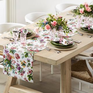 A spring floral table runner on a wooden table