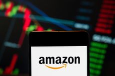 the American electronic commerce and cloud computing company Amazon (NASDAQ: AMZN) logo seen displayed on a smartphone with a graph in the background. 