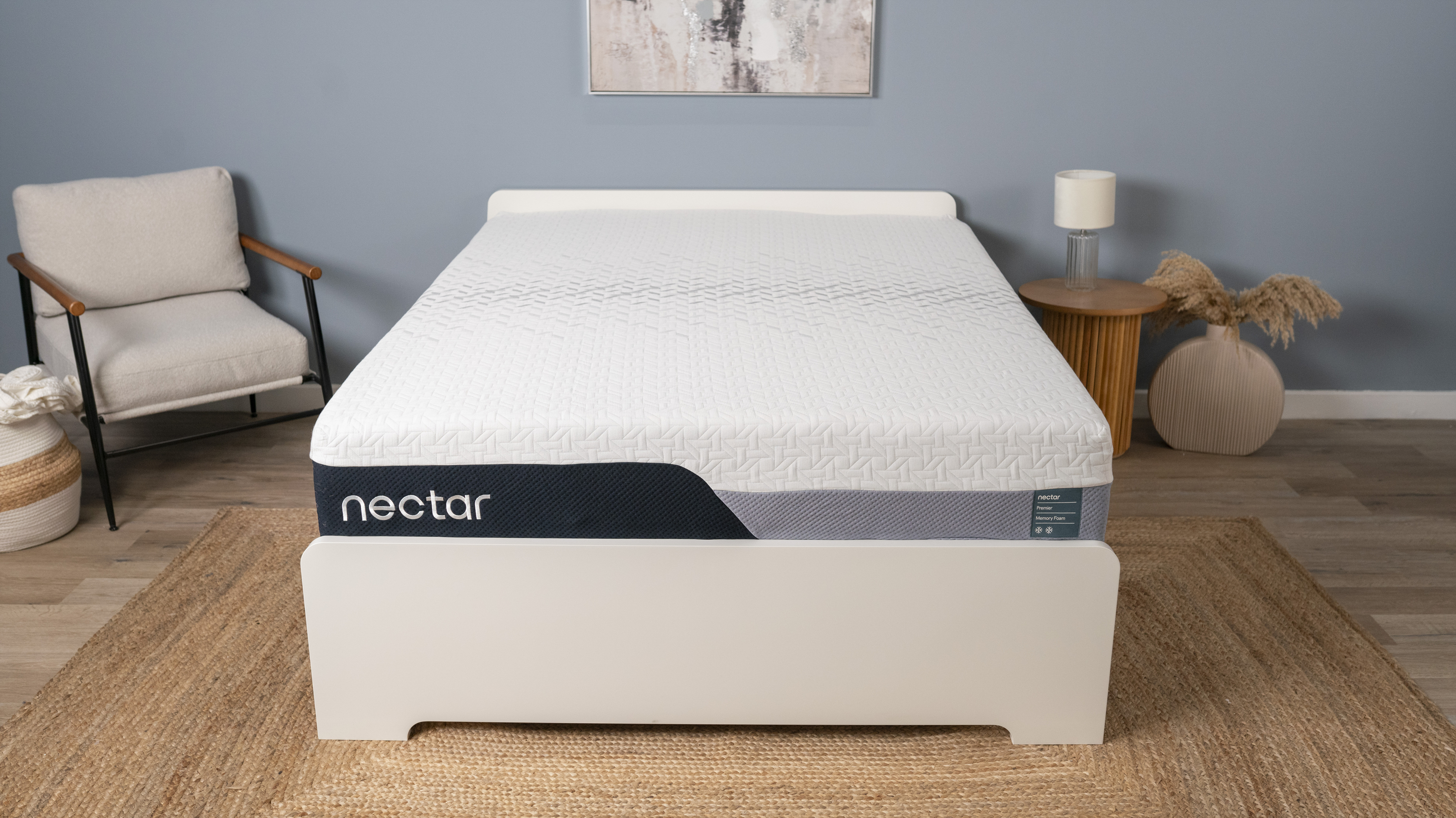 The image shows the Nectar Premier Memory Foam mattress in a neutral bedroom