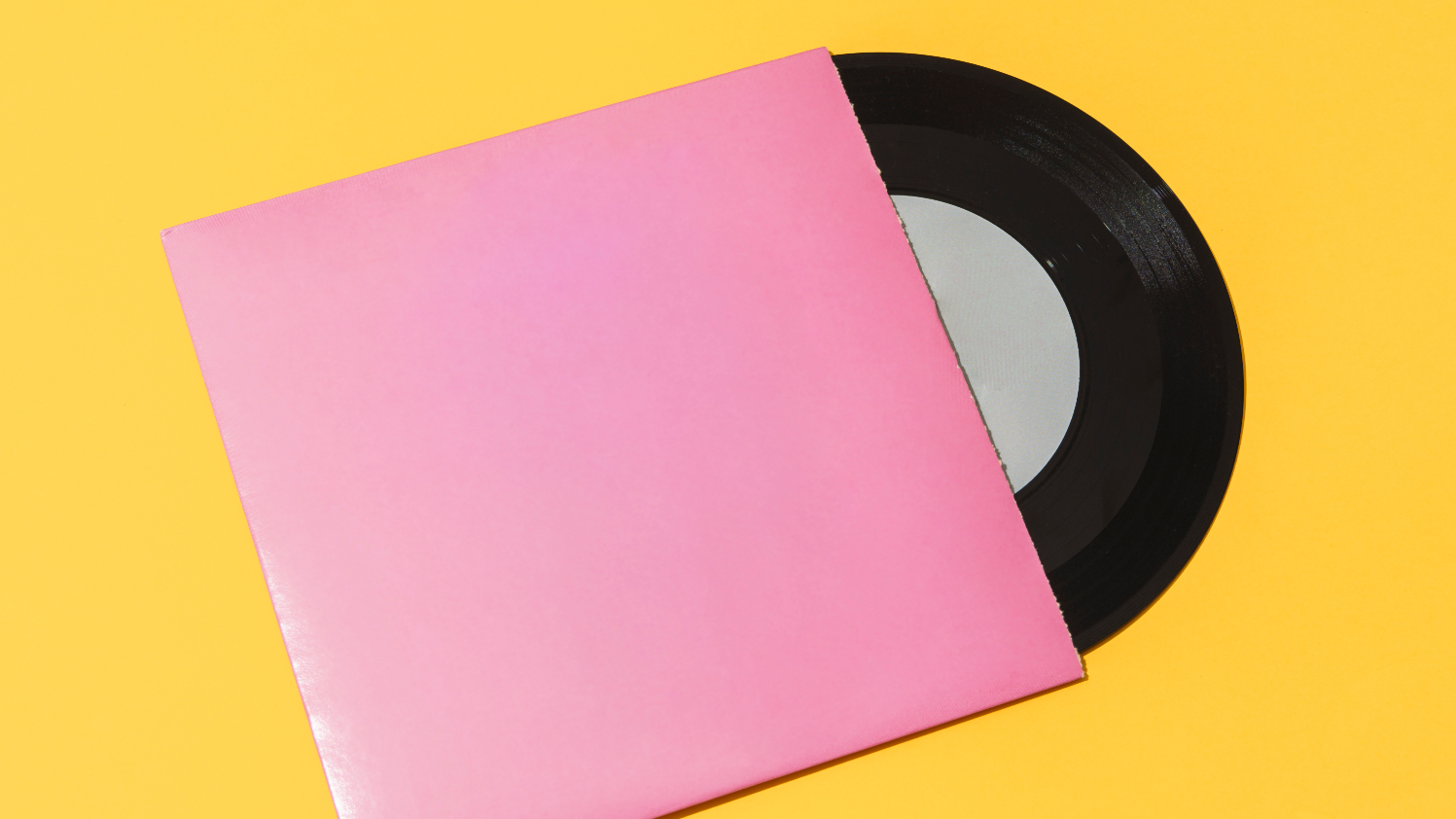 Directly above view of vinyl record isolated on yellow background