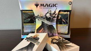 MTG Final Fantasy Starter Kit on a wooden surface, against a white wall