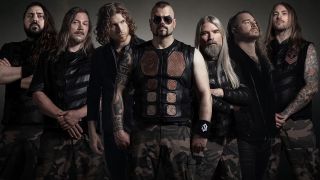 Members of Sabaton and Nothing More against a grey background in 2025