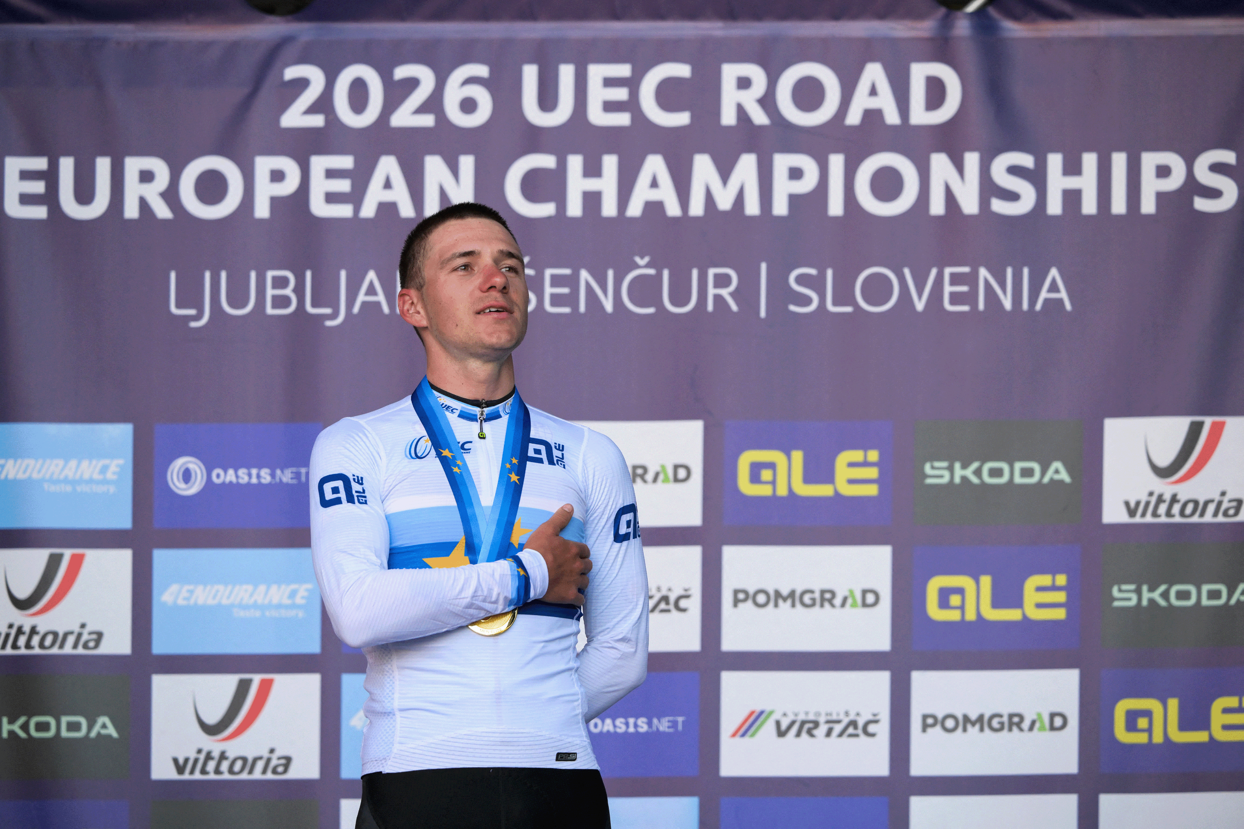 Gold medallist Belgium's rider Remco Evenepoel celebrates on the podium with his medal after winning the men's elite road race of the UEC European Road Cycling Championships in Sencur, near Ljubljana, Slovenia, on October 4, 2026. (Photo by JURE MAKOVEC / AFP via Getty Images)