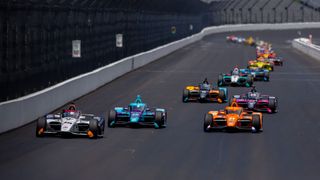  Christian Lundgaard leads a pack of cars during practice for the 106th Indy 500.