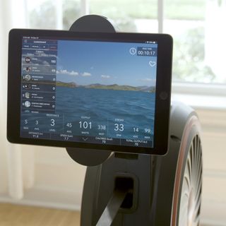 Echelon Row smart rowing machine and tablet showing Echelon app