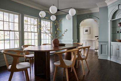 A dining room painted light blue