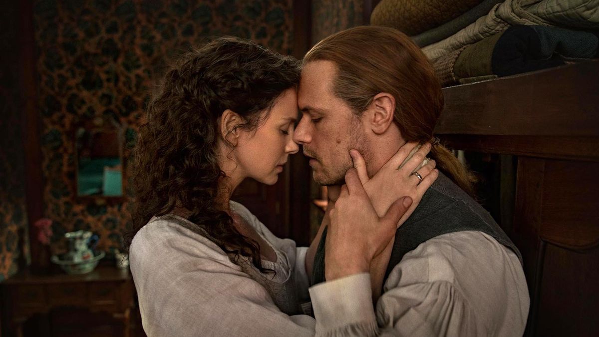 Caitriona Balfe as Claire and Sam Heughan as Jamie Fraser are close to kissing in Outlander season 6