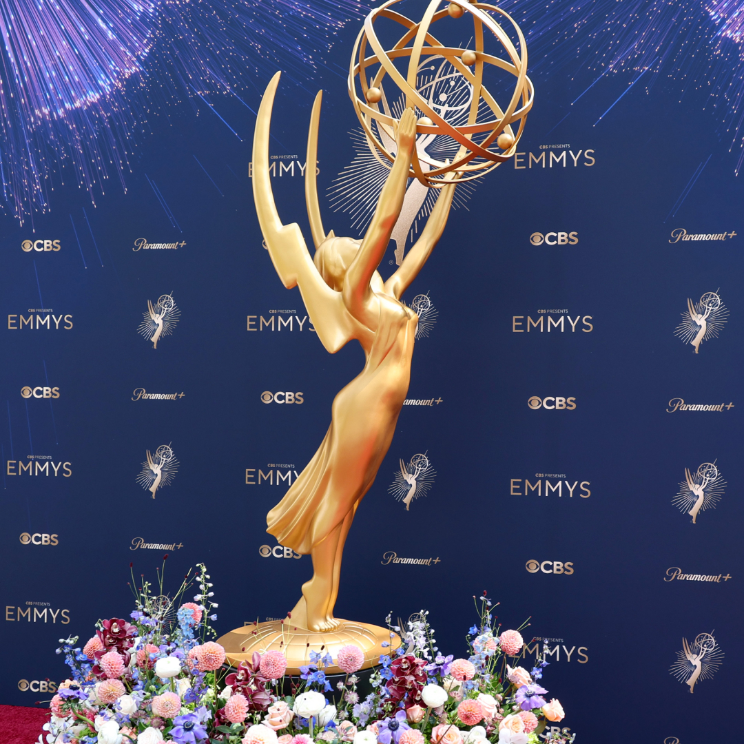 the emmys red carpet with a giant emmy statue