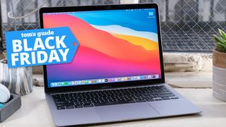 MacBook Air on a desk with a Black Friday tag superimposed