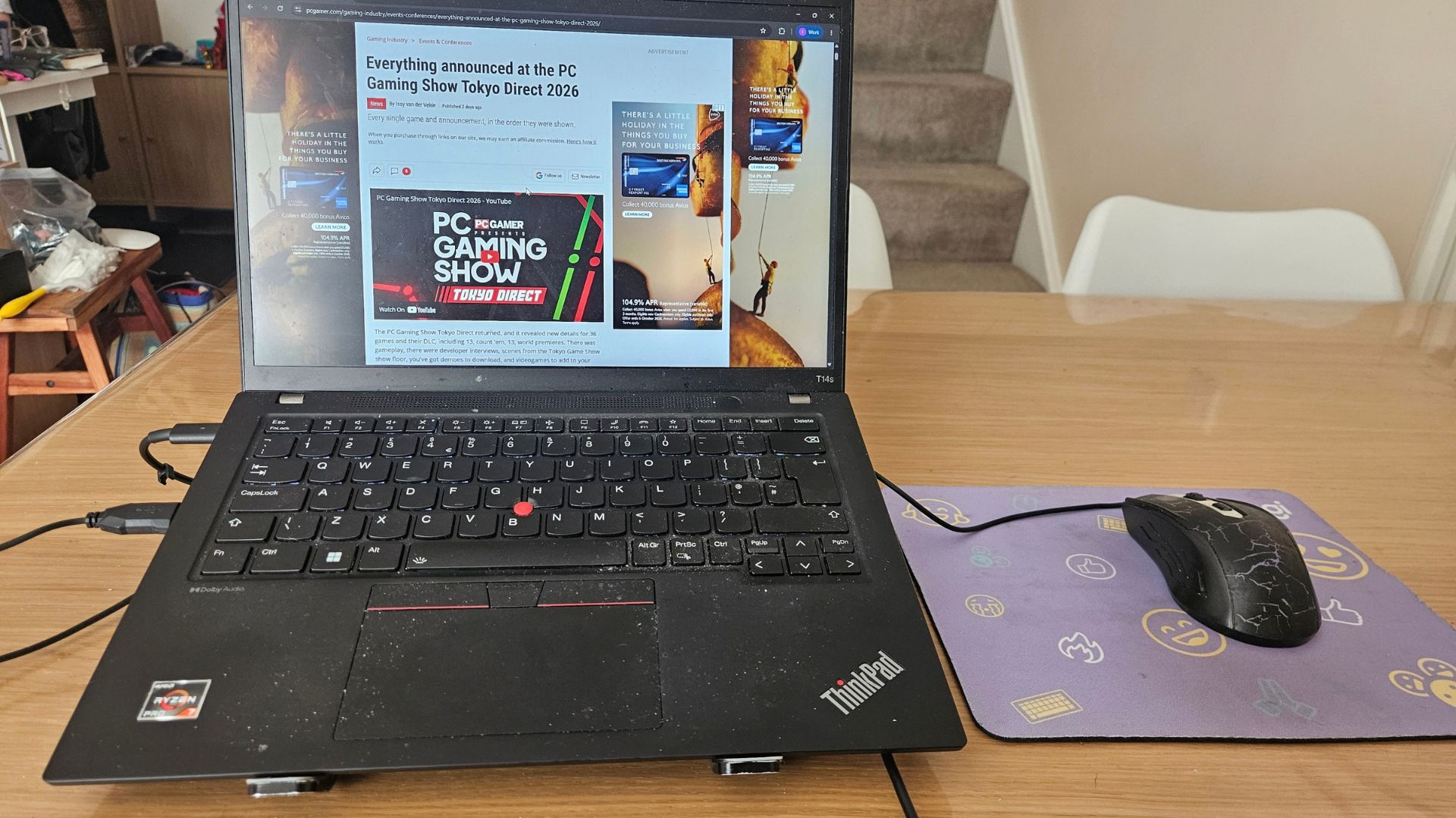 Issy van der Velde's desk, showing a thinkpad laptop and gaming mouse
