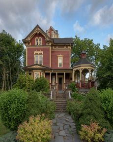 Garden Of Plants And Trees In Front Of A House