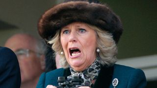 Queen Camilla watches the 'Queen Mother Champion Steeple Chase' horse race on day 2 'Ladies Day' of the Cheltenham Horse Racing Festival