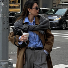 Woman wearing fall outfit featuring black ankle boots.