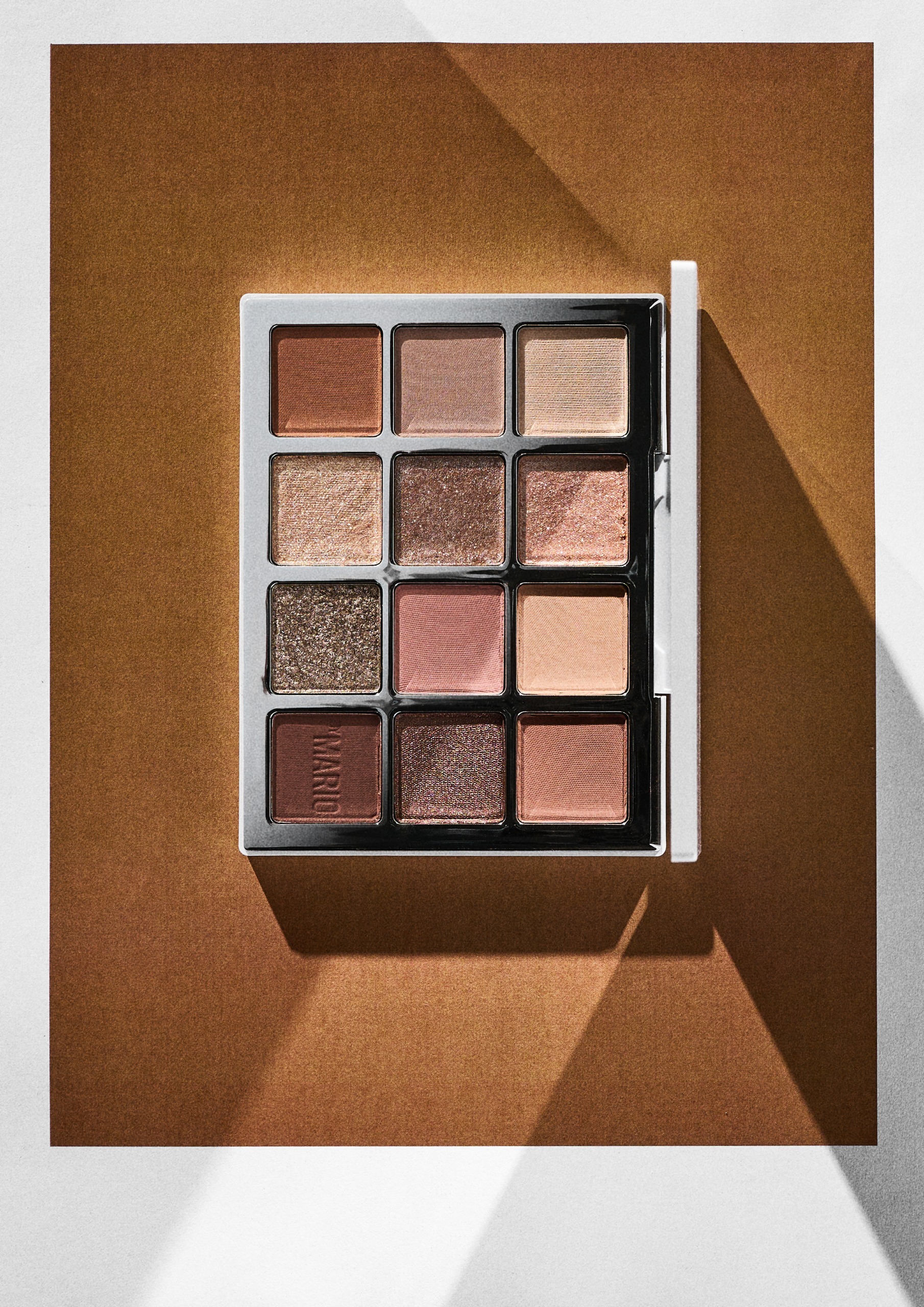 Makeup by Mario's Ethereal Eyes Eyeshadow Palette on an orange background