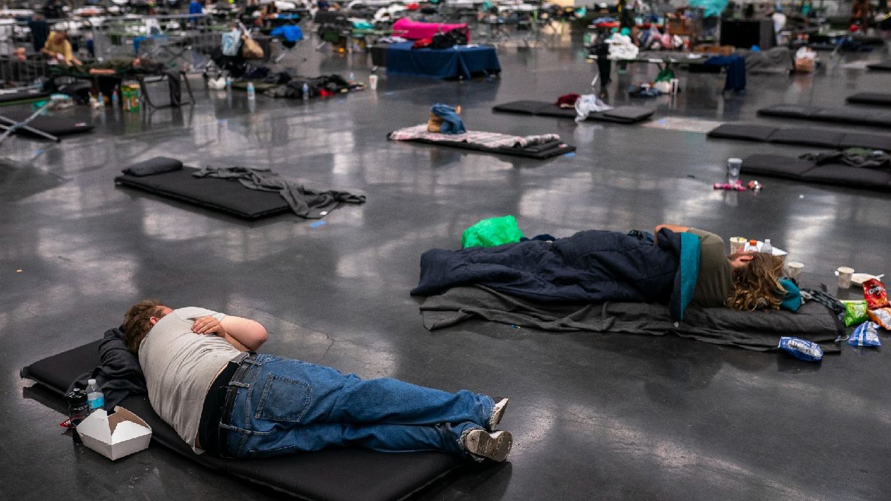 People lying on the ground to cool down from blistering temperatures