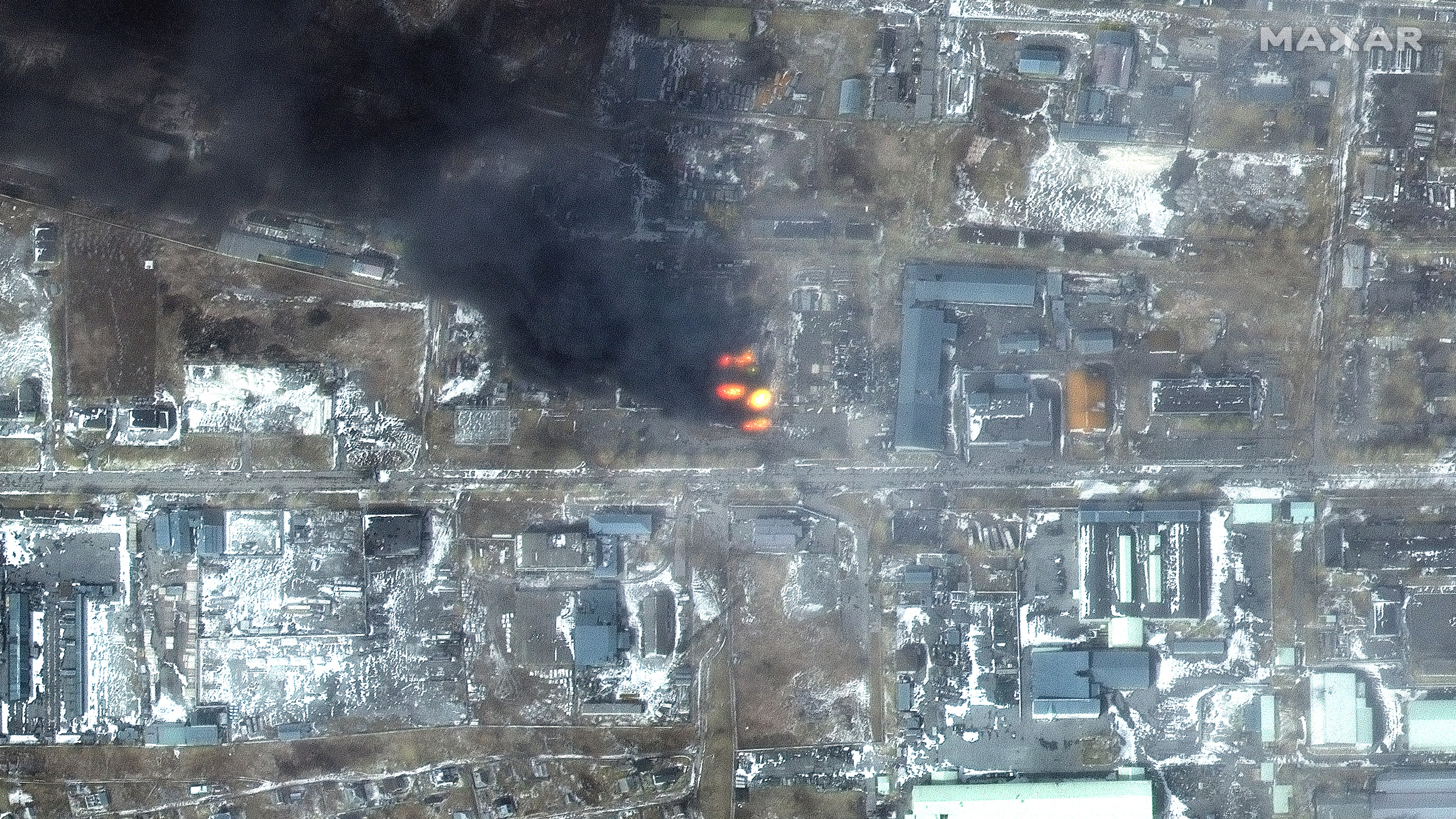 Fires burn in Mariupol's shelled industrial district.