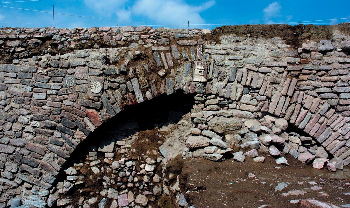 The east end of the tunnel, where the water exited, was decorated in petroglyphs and stucco reliefs.