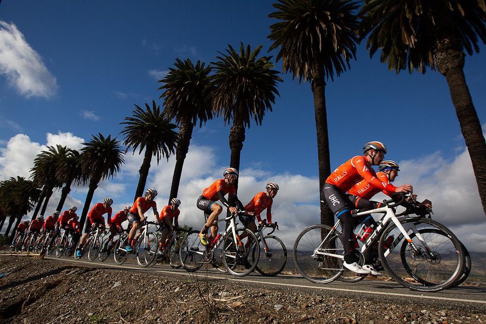 Rally UHC riders train under a line of palms during a recent camp in Southern California