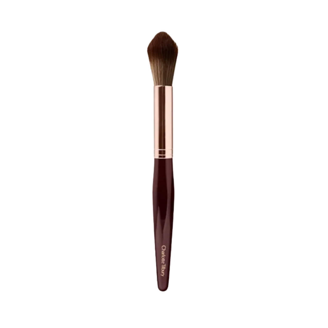 A product shot of the Charlotte Tilbury Powder and Sculpt brush, on a white background