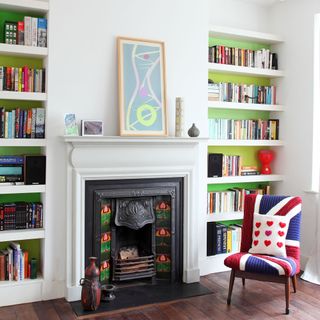bookshelves with fireplace and chair