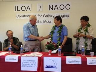 Steve Durst, founding director of ILOA and Jun Yan, Director General of China's NAOC, shake hands after signing agreement on September 4 to collaborate on using future moon landers to carry out science duties from the lunar surface