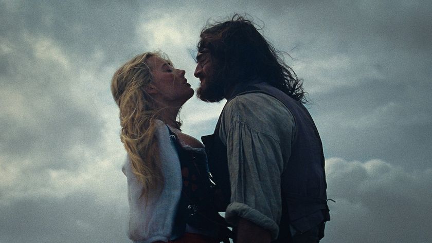 Margot Robbie and Jacob Elordi with cloudy skies behind them in Wuthering Heights