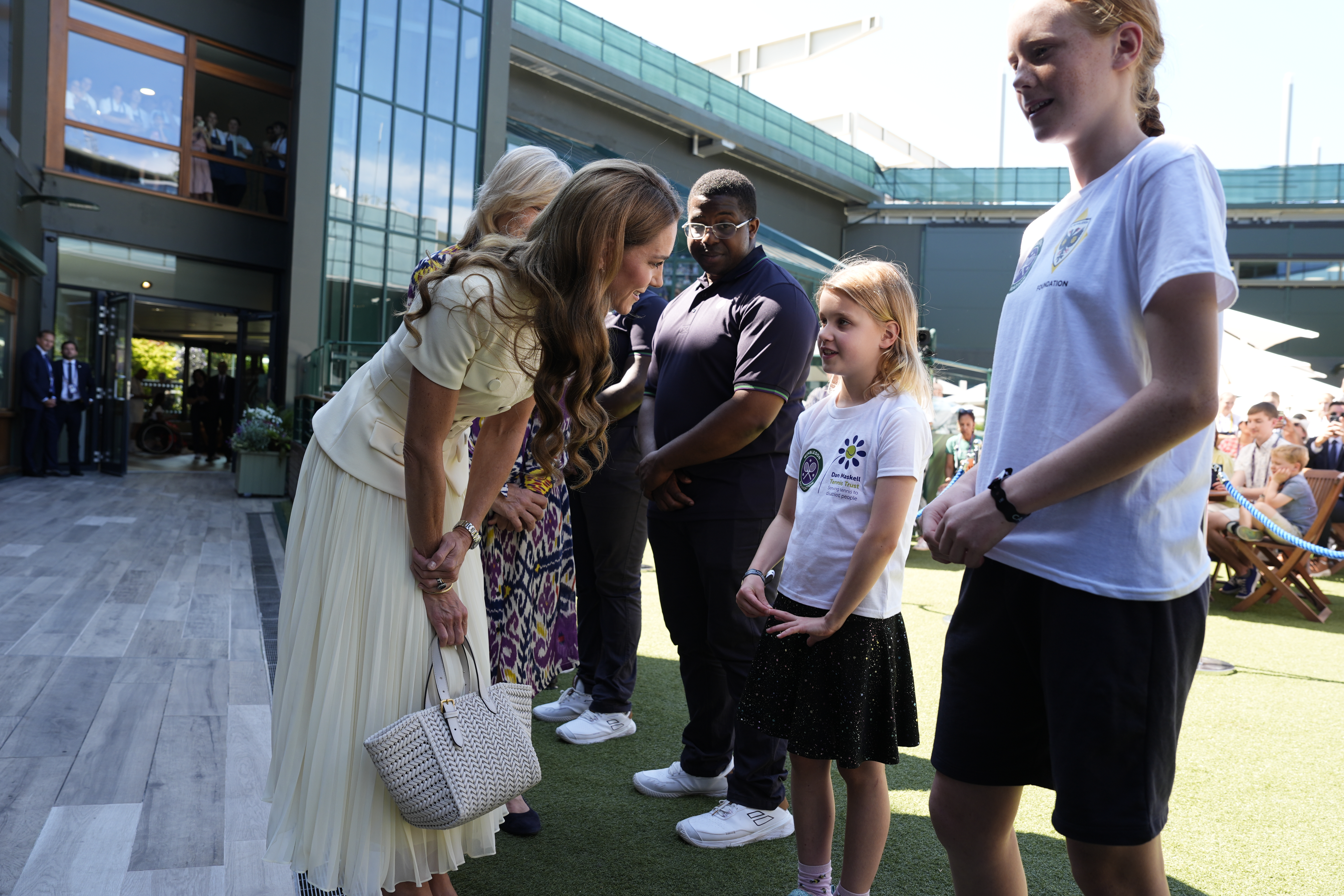 The Princess of Wales meeting 8-year-old Lydia Lowe from the Dan Maskell Tennis Trust at the Ladies' Singles Final during day thirteen of The Championships Wimbledon 2025 at All England Lawn Tennis and Croquet Club on July 12, 2025