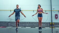 Man and woman jumping rope for fitness