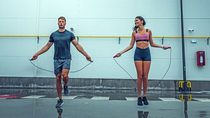 Man and woman jumping rope for fitness
