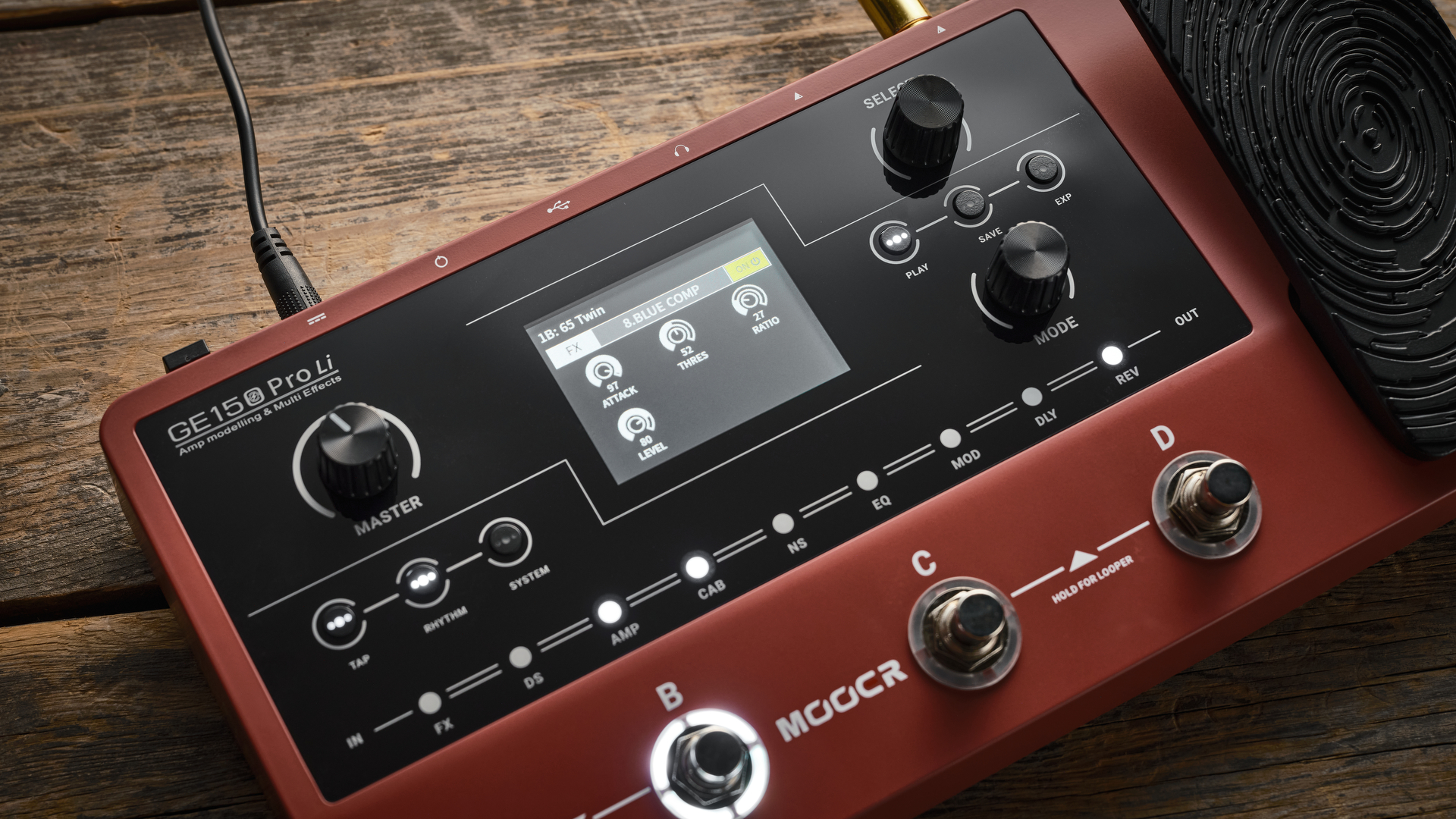 Mooer GE150 Pro li on wooden floor