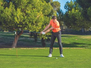 Gary Munro demonstrating a drill for the takeaway with a long iron golf swing