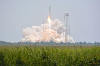An Antares rocket lifts off from NASA's Wallops Flight Facility in Virginia with the SpaceShip (SS) Janice Voss, the third of Orbital Sciences' space station-bound cargo freighters.