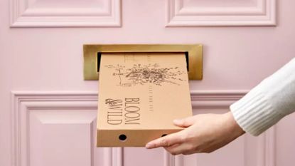 Best flower delivery UK: Bloom & Wild letterbox flowers package being posted through pink door