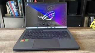 Asus ROG Zephyrus G14 gaming laptop on a wooden table