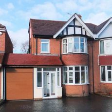 pubs with sloping roof tops white doors and white windows