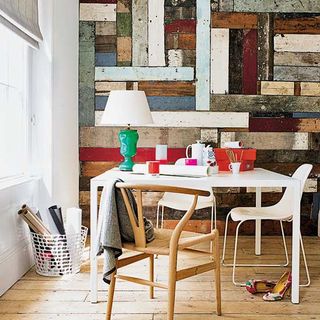 colourfull wall room with white desk and chair