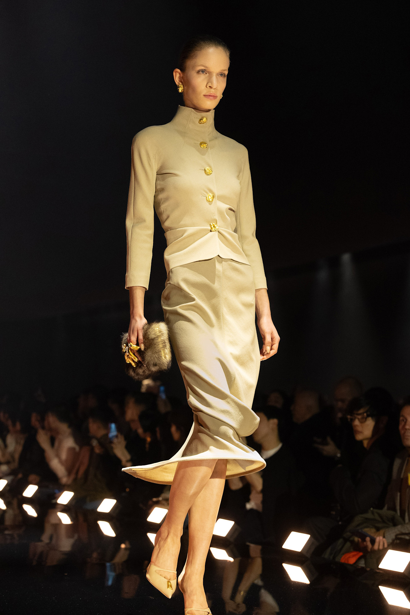 A model walking in the Schiaparelli show during the F/W 2026 show wearing a skirt suit.