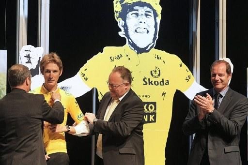Andy Schleck dons the yellow jersey for winning the 2010 Tour de France following the disqualification of Alberto Contador.