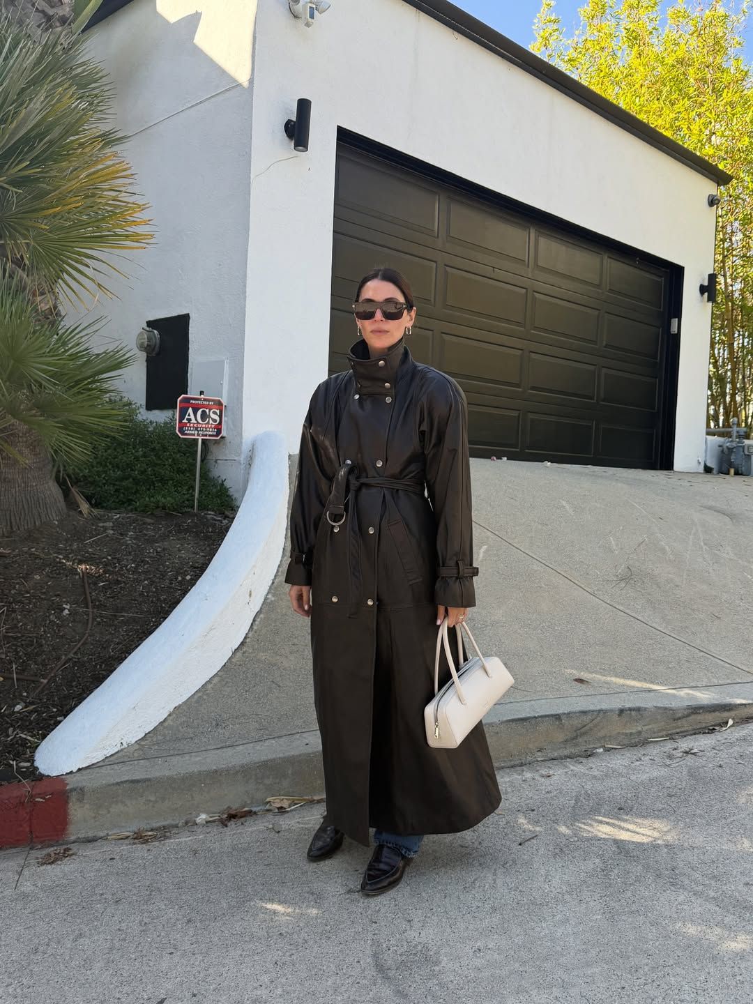 Jen Wonders in a leather funnel-neck jacket.