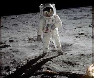 Astronaut Buzz Aldrin walks on the surface of the moon near the leg of the lunar module Eagle during the Apollo 11 mission on July 20, 1969. 