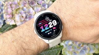 Close-up of the Garmin Forerunner 70 entry-level running watch in white
