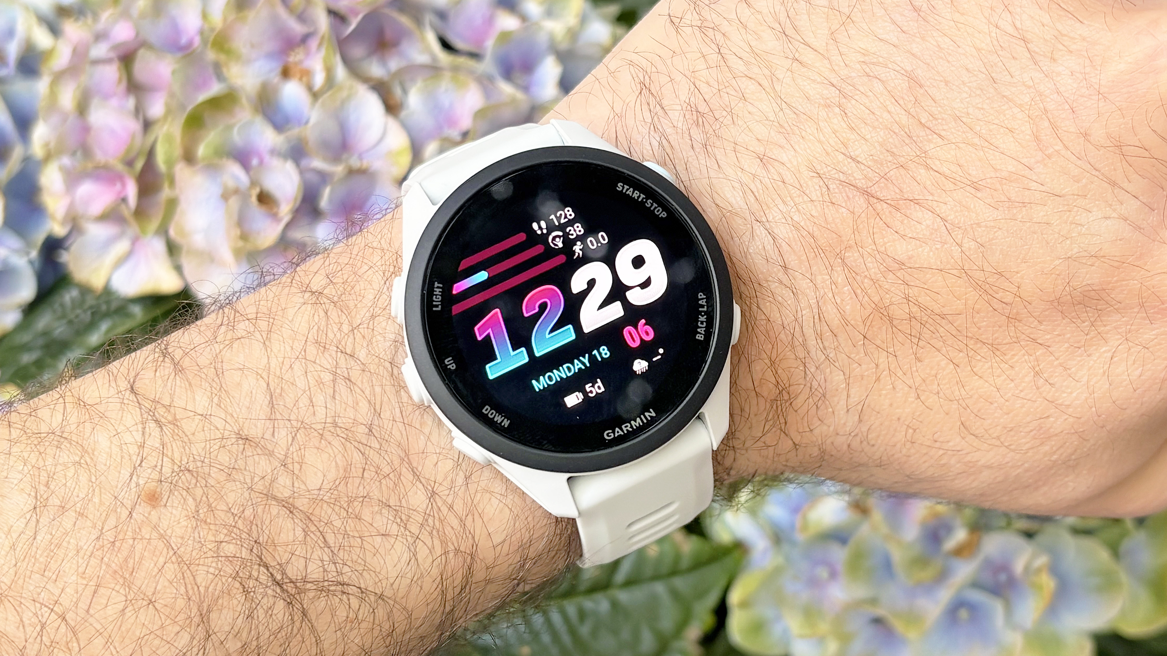 Close-up of the Garmin Forerunner 70 entry-level running watch in white
