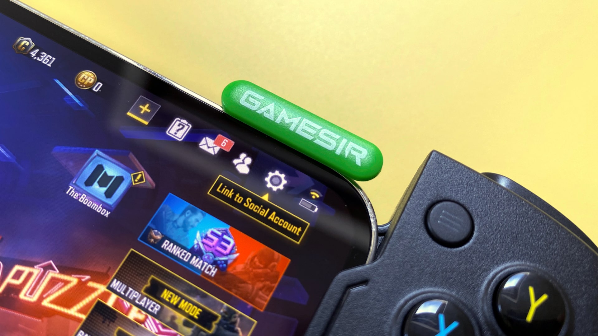 The GameSir X4 Aileron iOS games controller against a yellow background.