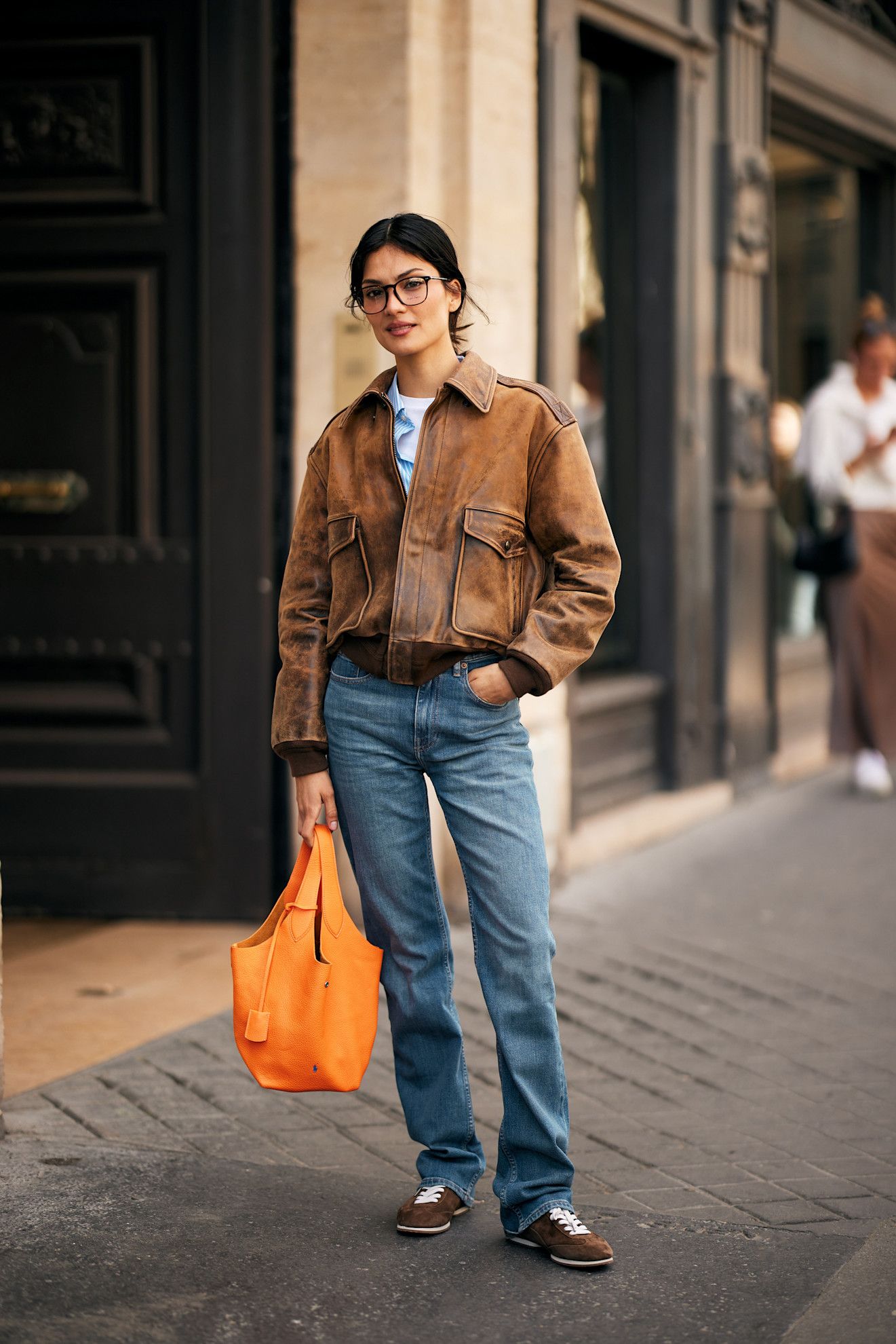 Woman wearing skinny jeans controversial denim trend.