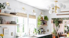 Globe pendant and wall lights in a bright kitchen