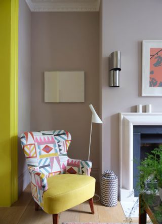 Yellow and grey living room with accent chair and built in bookcase