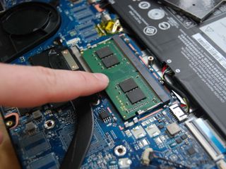 Press down on the RAM to clip it in place